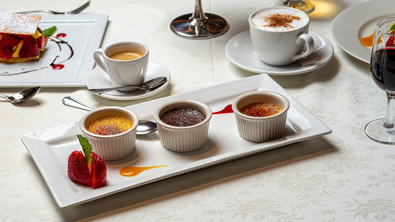 Creme brulee dessert with cup of espresso